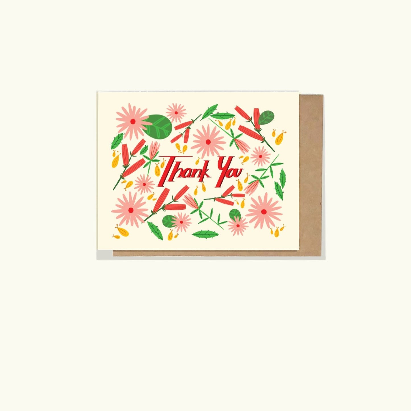 A greeting card a with happy floral illustration and a hand written block front stating 'thank you' on the front