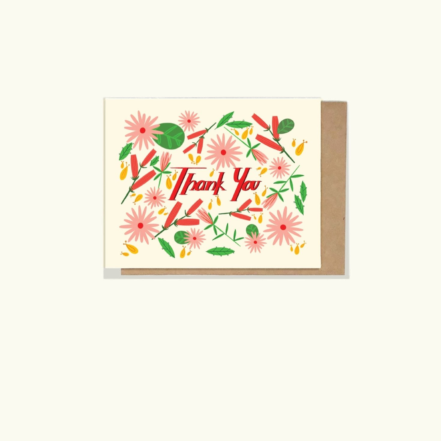 A greeting card a with happy floral illustration and a hand written block front stating 'thank you' on the front