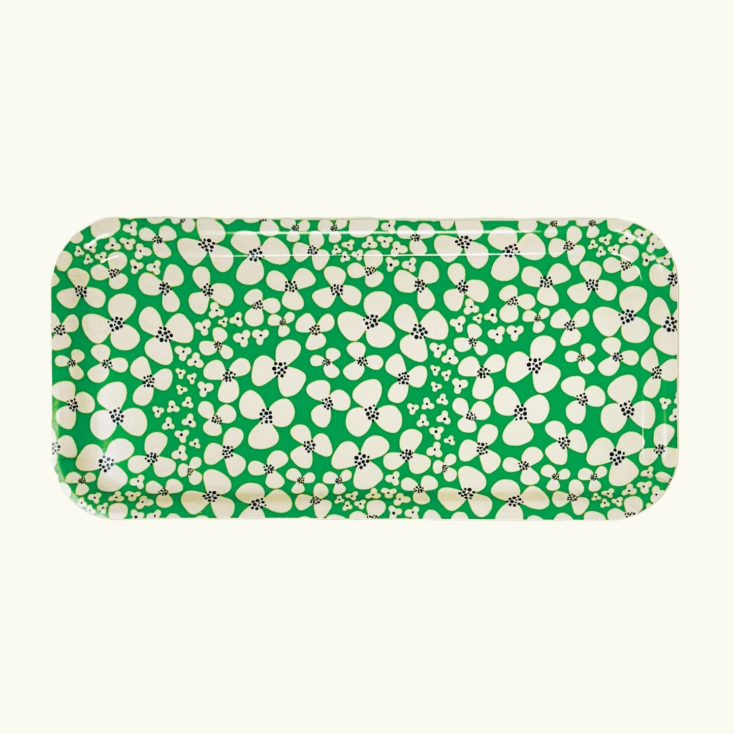 A rectangular birch wood tray with a green and white happy floral pattern.