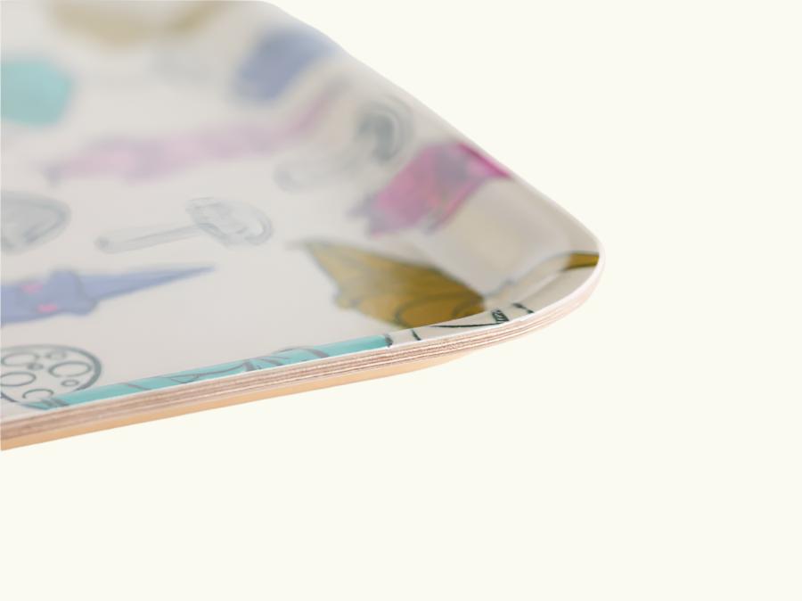 A rectangular birch wood tray with a whimsical pattern of gnomes,and mushrooms in various colors.3