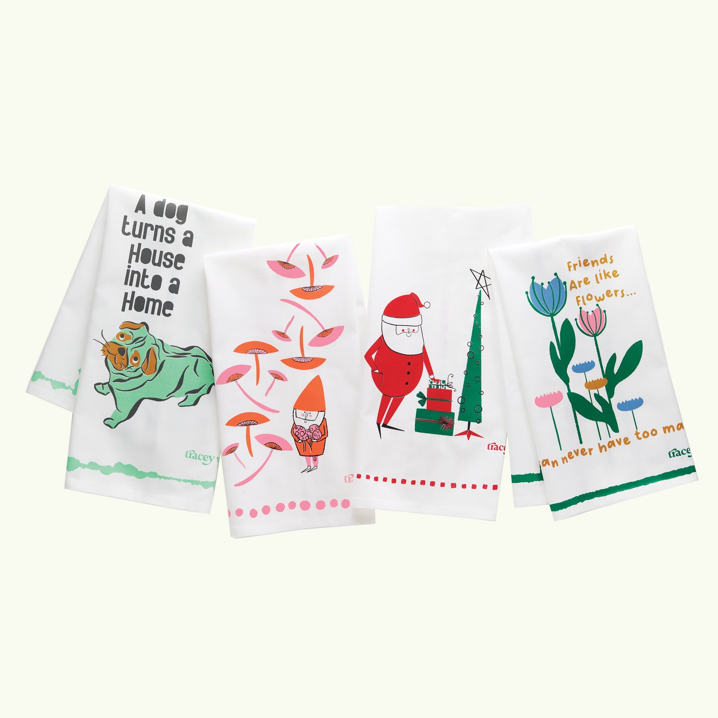 A white dish towel with orange and pink illustrations of gnomes, mushrooms, and polka dots.3

