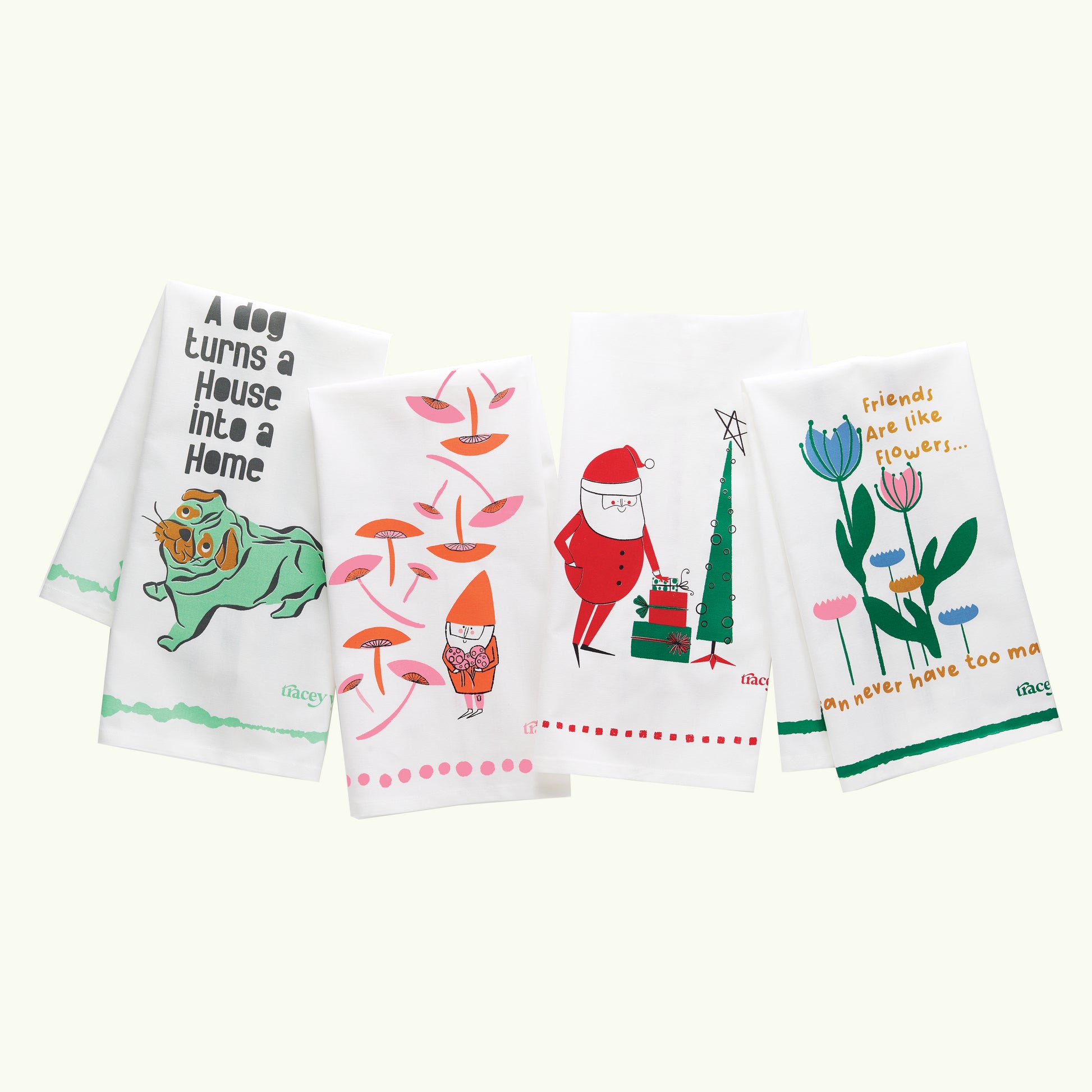 A white dish towel with orange and pink illustrations of gnomes, mushrooms, and polka dots.3

