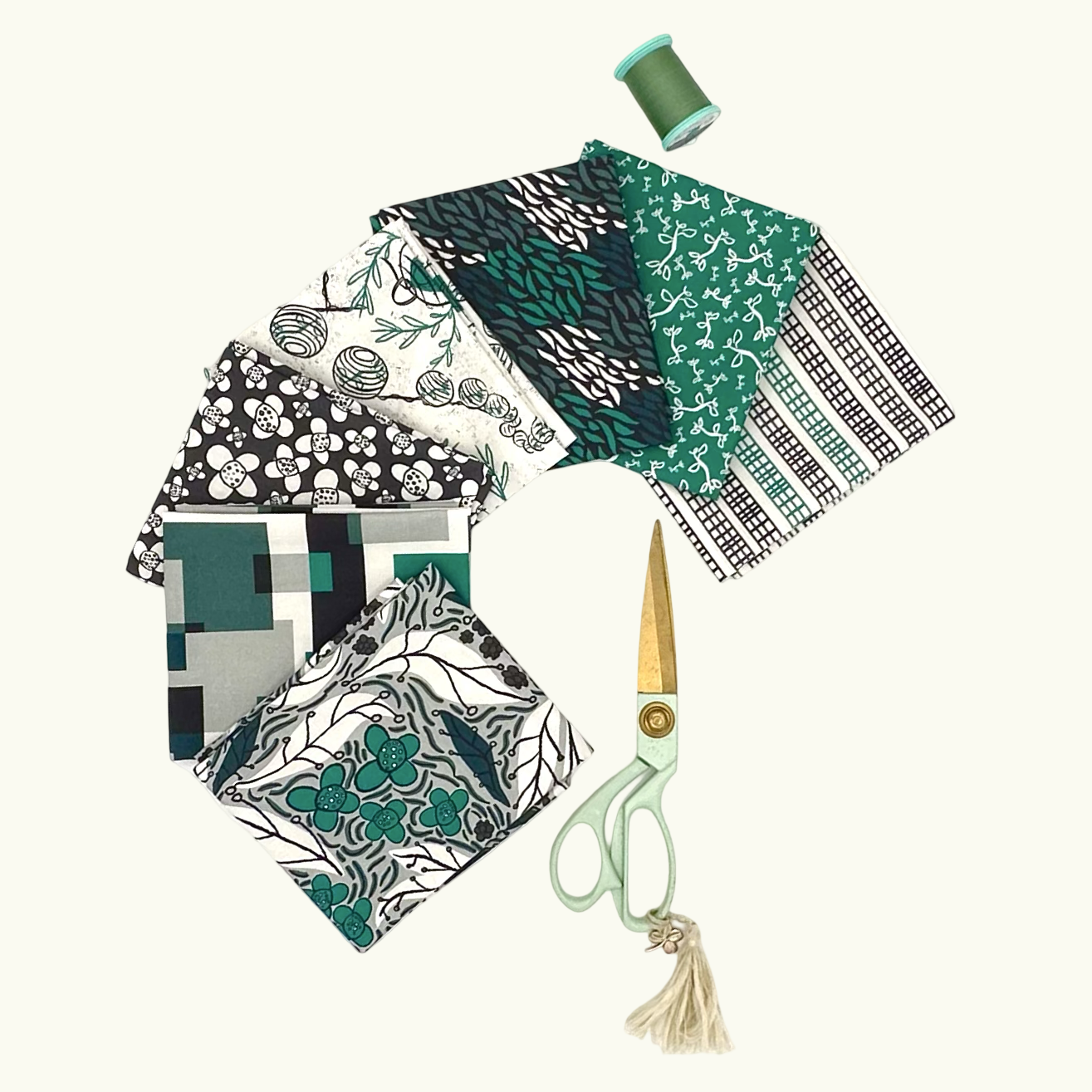 Collection of patterned fabric samples with a pair of scissors on a white background

