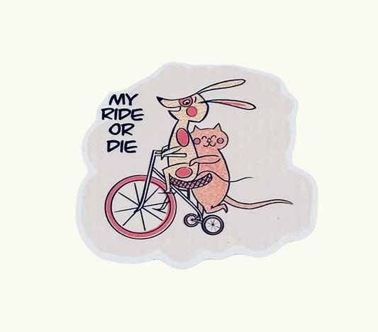 Sticker with cartoon cat and dog on a bicycle with 'My Ride or Die' text.


