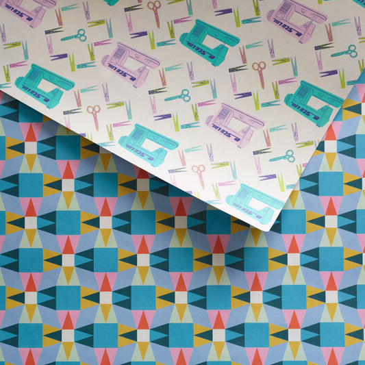 double sided giftwrap with Sewing machines on one side and a quilt pattern design on the other